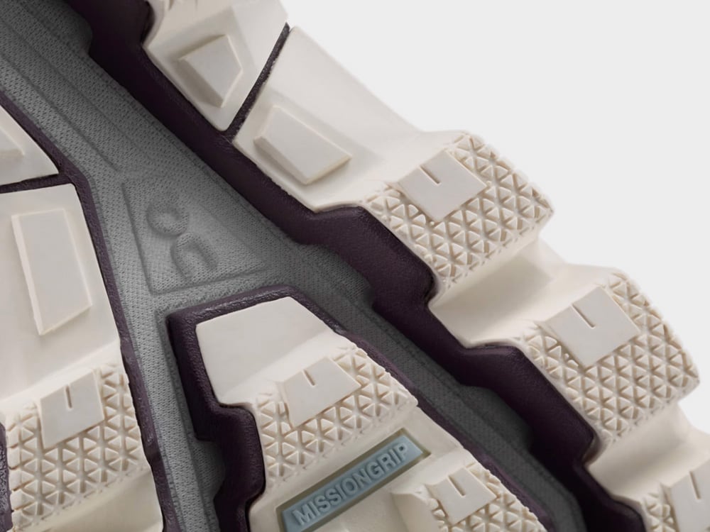 Close-up of a shoe sole with 'Missiongrip' branding on a white background