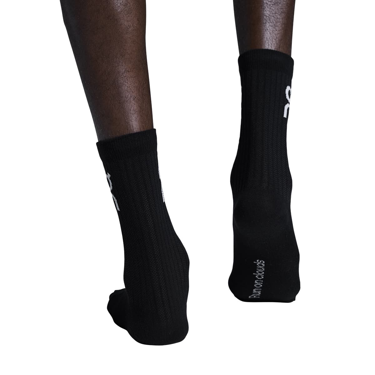 Model wearing the On Logo Sock High 3P Colour Black - Back View