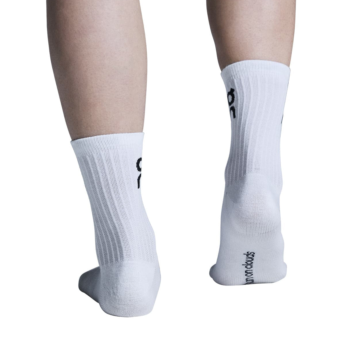 Model wearing the On Logo Sock High 3P Colour White - Rear View