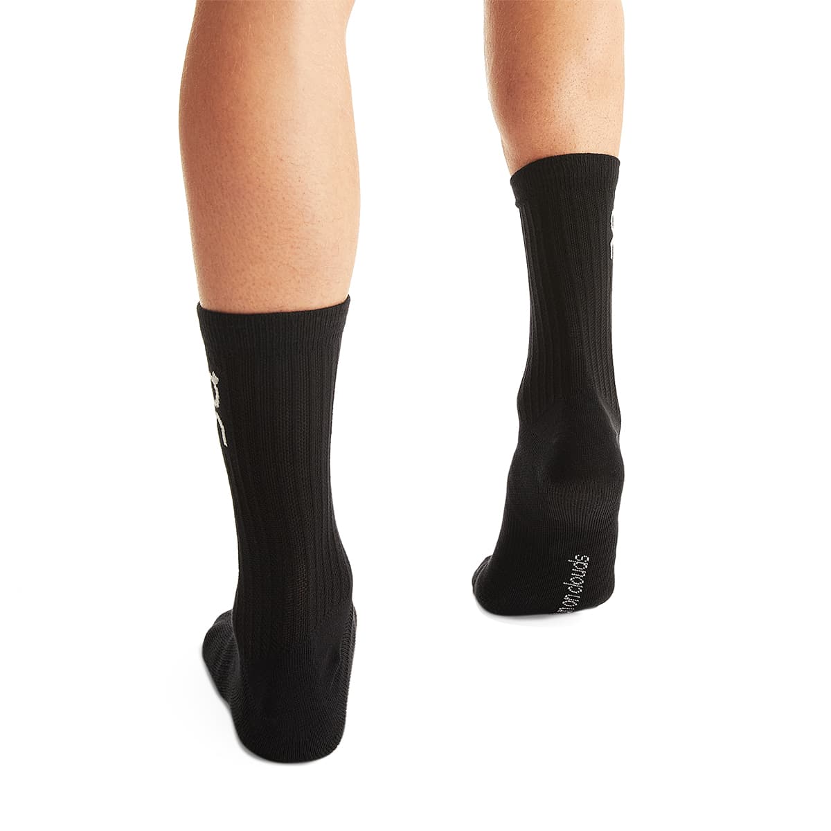 Man wearing the On Logo Sock 3 Pack Colour Black - Back Angle