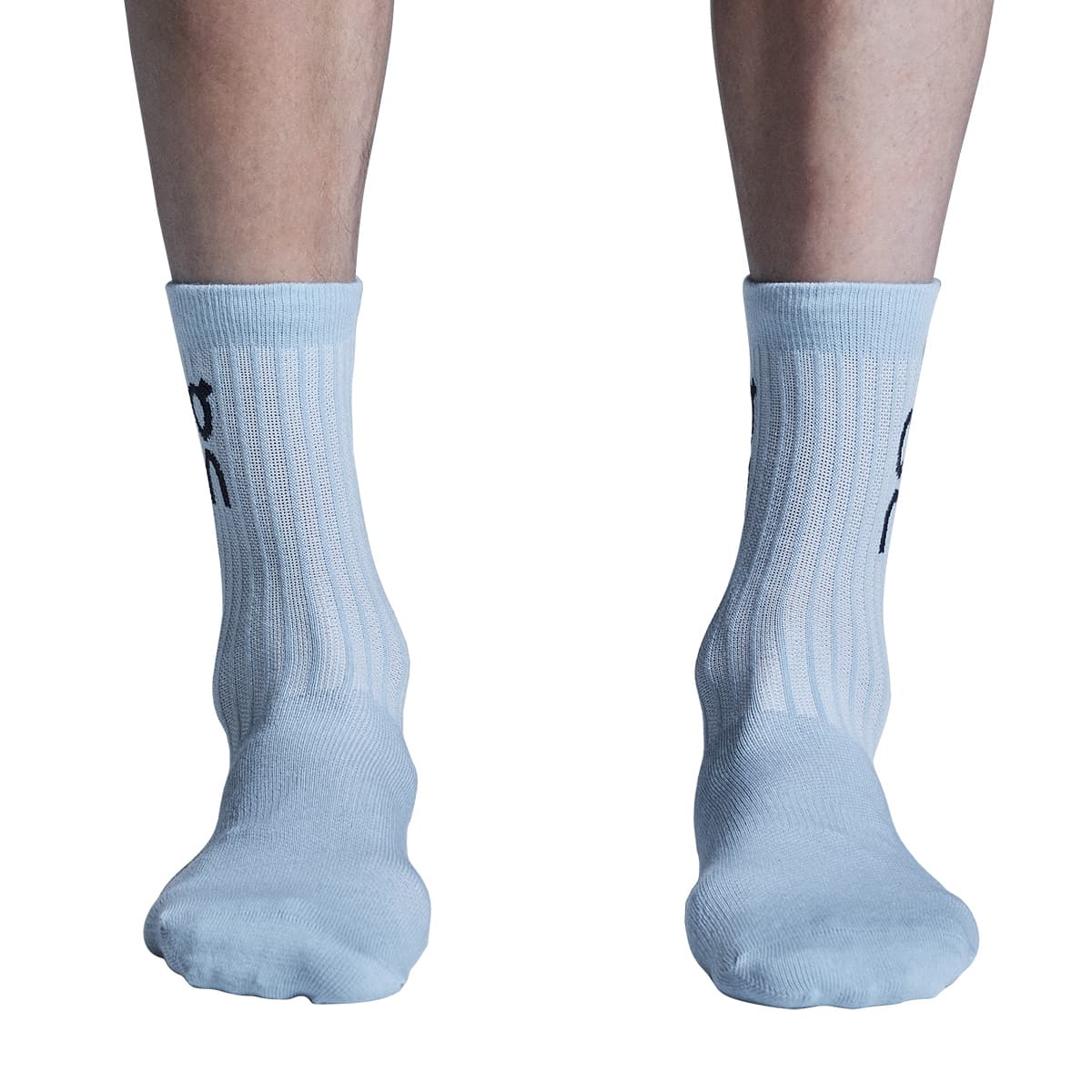 Model wearing the On Logo Sock 3 Pack Colour Wash Navy - Front View