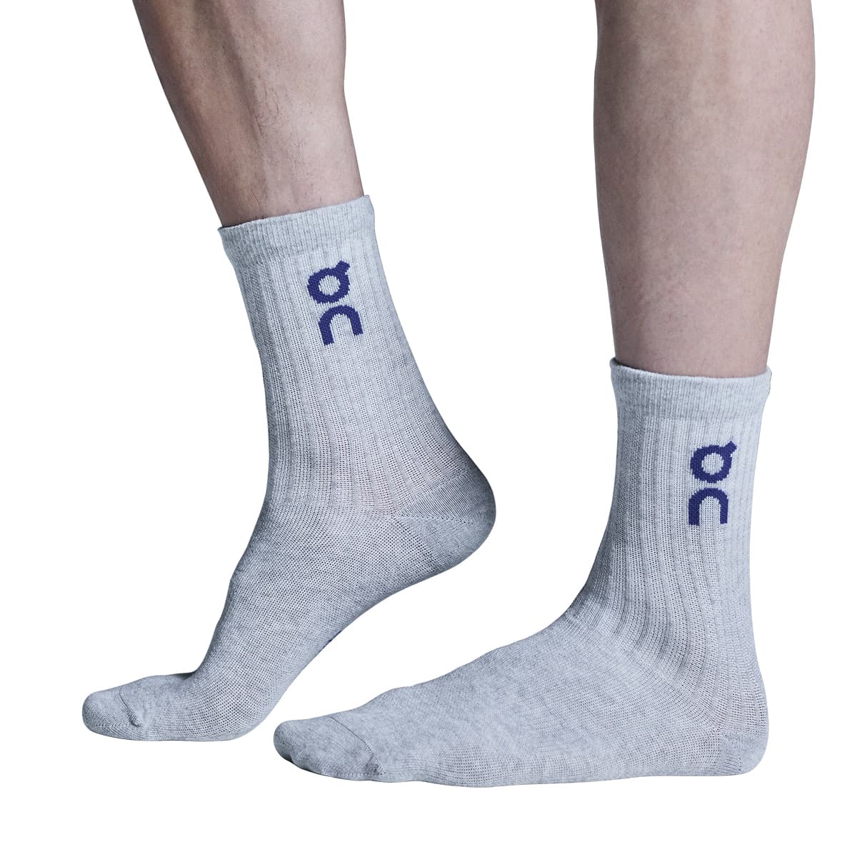 Model wearing the On Logo Sock 3 Pack Colour Wash Navy - Side View