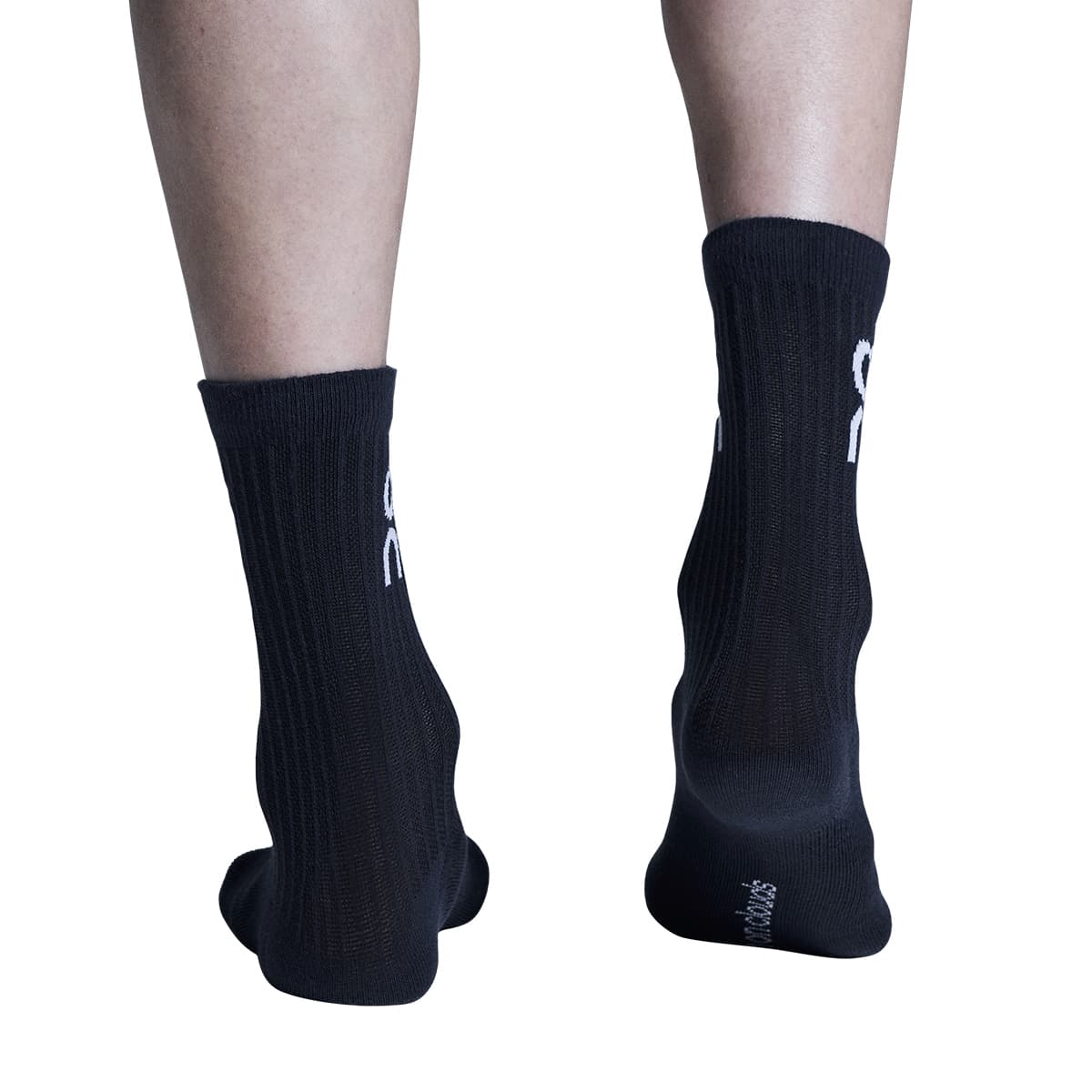 Model wearing the On Logo Sock 3 Pack Colour Wash Navy - Rear View