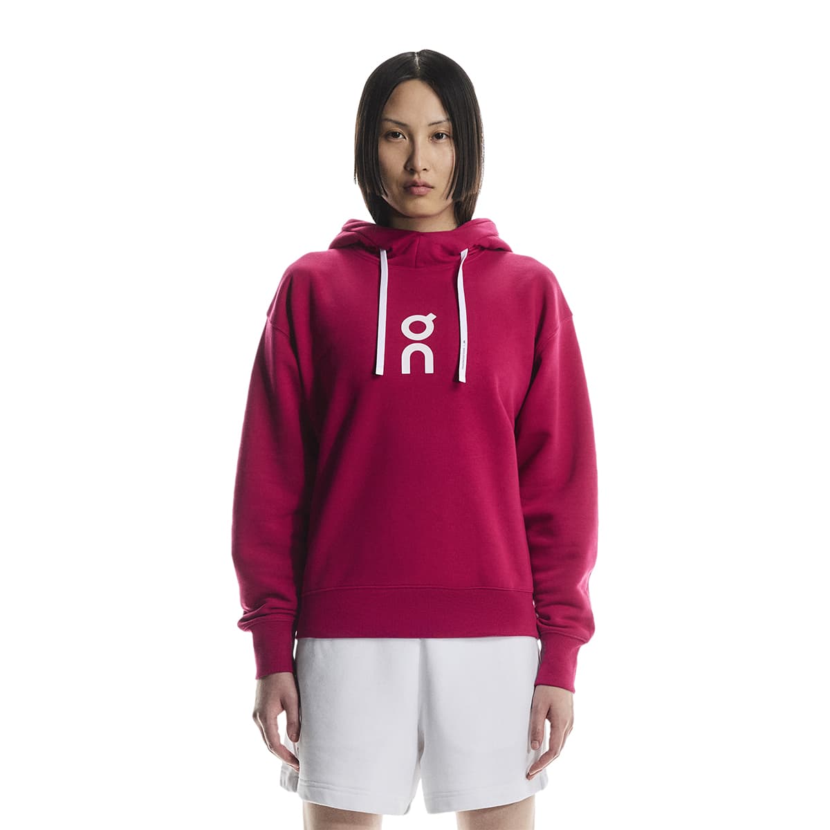 Female model wearing the On Apparel - Club Hoodie Colour Grenadine, shown from the front