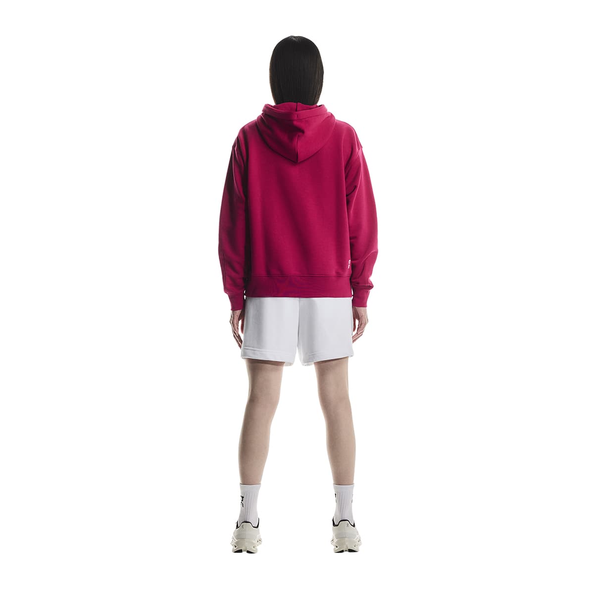 Rear view of female model wearing the On Apparel - Club Hoodie Colour Grenadine