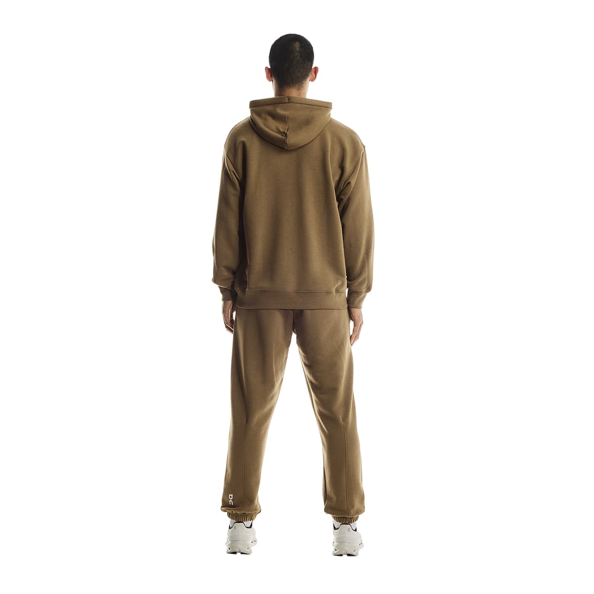 Rear view of male model wearing the On Apparel - Club Hoodie Colour Nutmeg