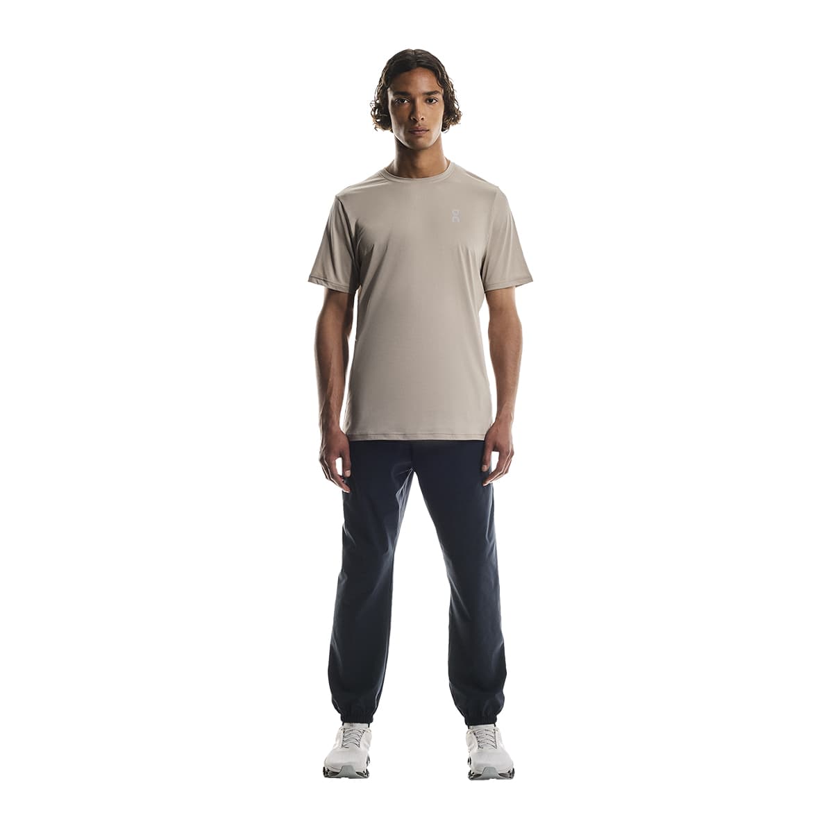 Full-body of male model wearing the On Apparel - Core T Colour Desert