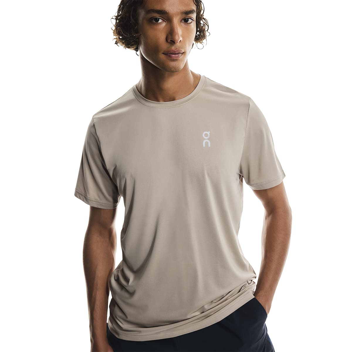 Male model wearing the On Apparel - Core T Colour Desert in a relaxed pose