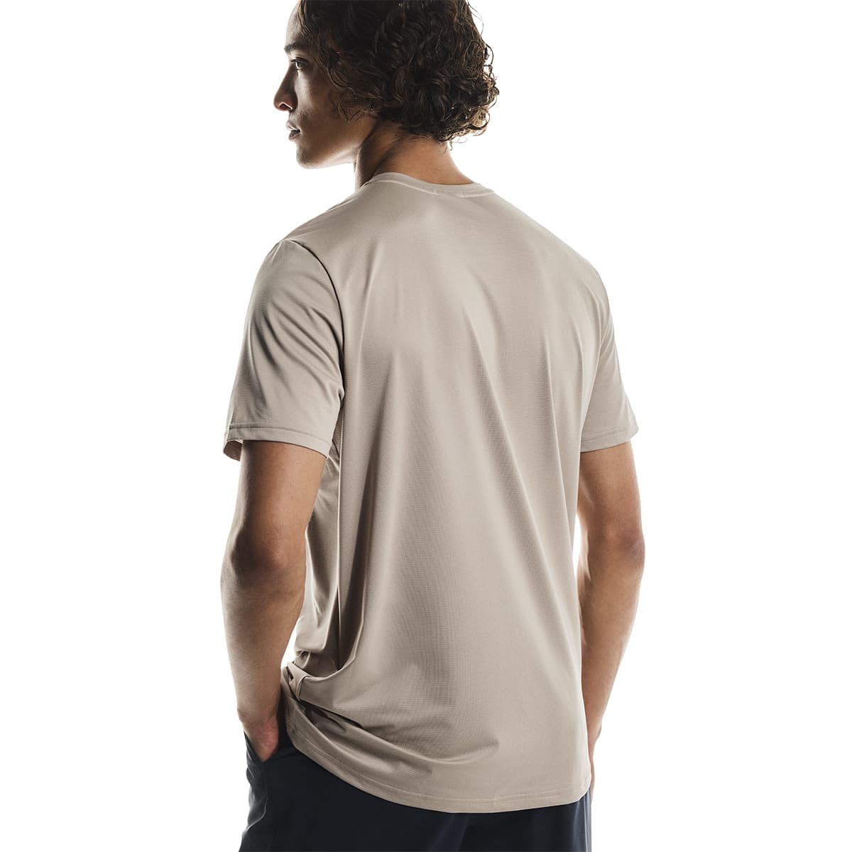 Male model wearing the On Apparel - Core T Colour Desert, turned away