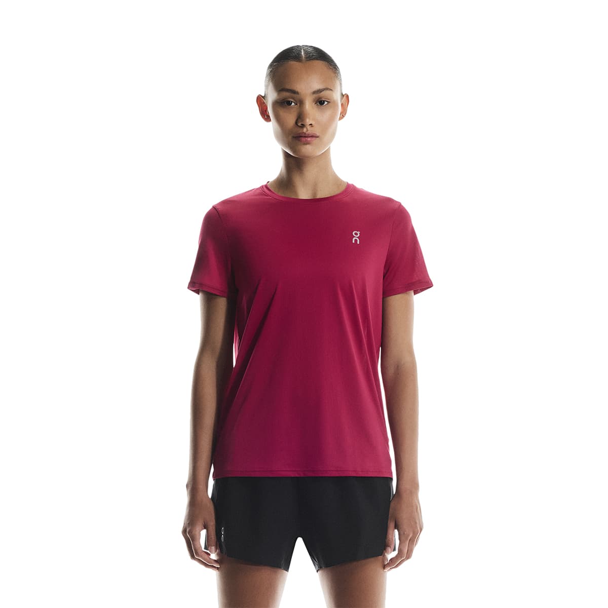 Woman wearing the On Apparel - Core T Colour Grenadine, shown from the front #color_grenadine