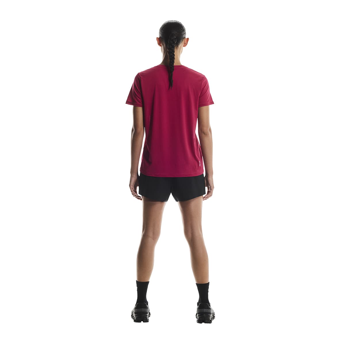 Woman wearing the On Apparel - Core T Colour Grenadine, shown from the back #color_grenadine