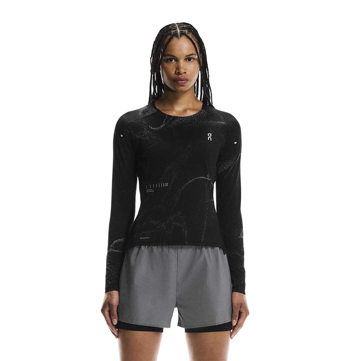 Female model wearing the On Apparel - Performance Long T Lumos Colour Black, shown from the front