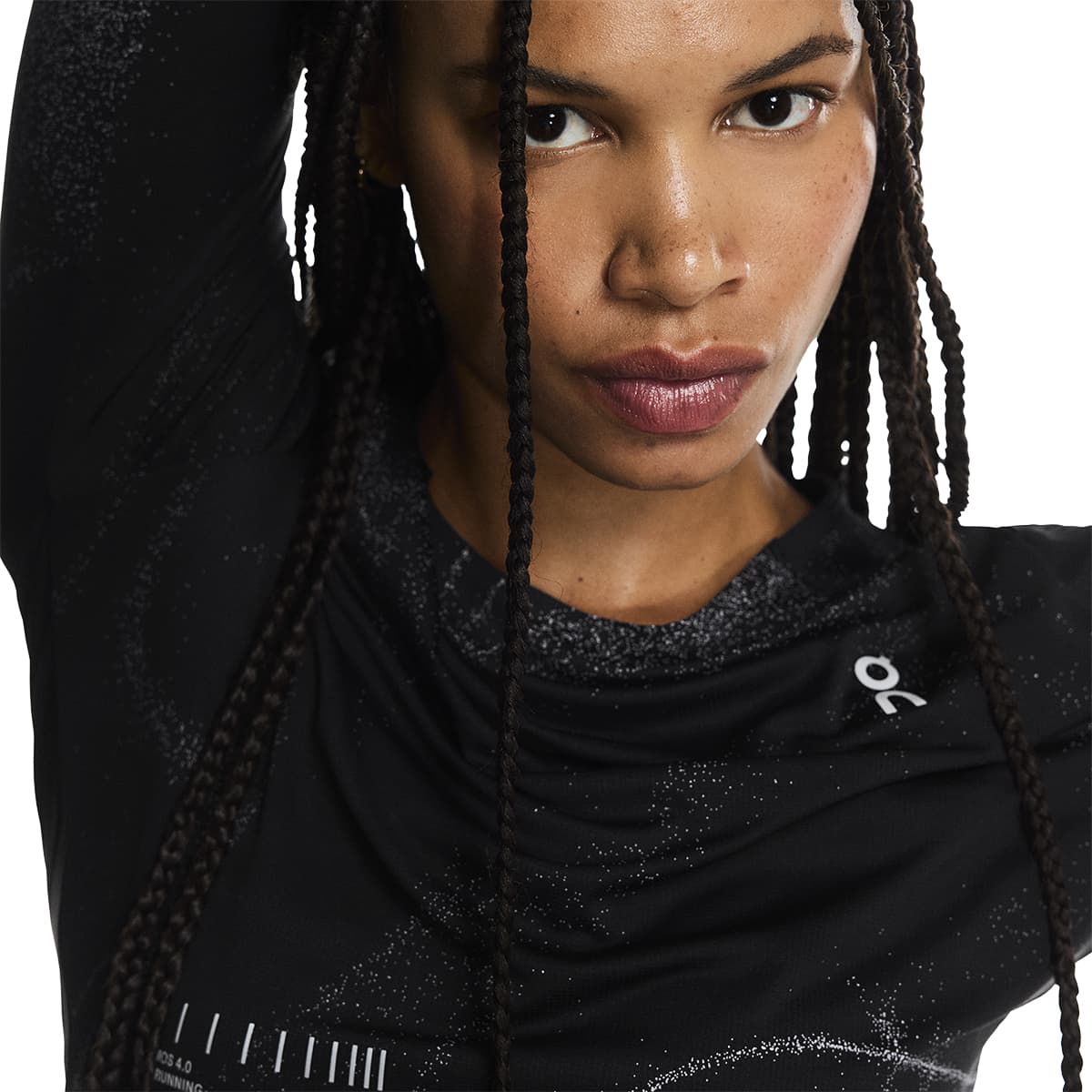 Close-up of female model wearing the On Apparel - Performance Long T Lumos Colour Black