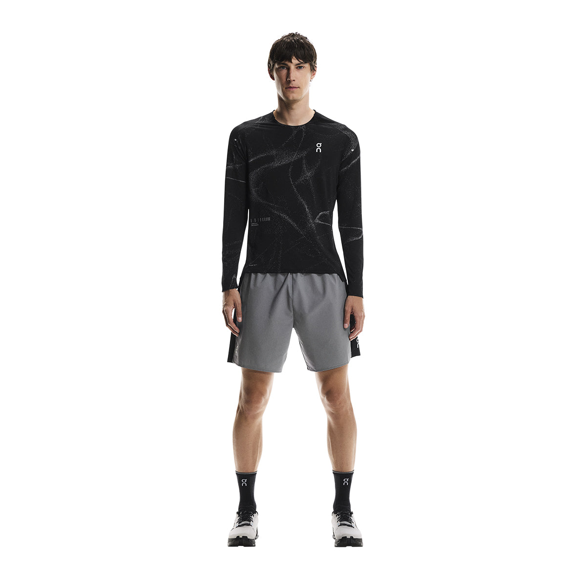 Full front view of male model wearing the On Performance Shorts Lumos in Black