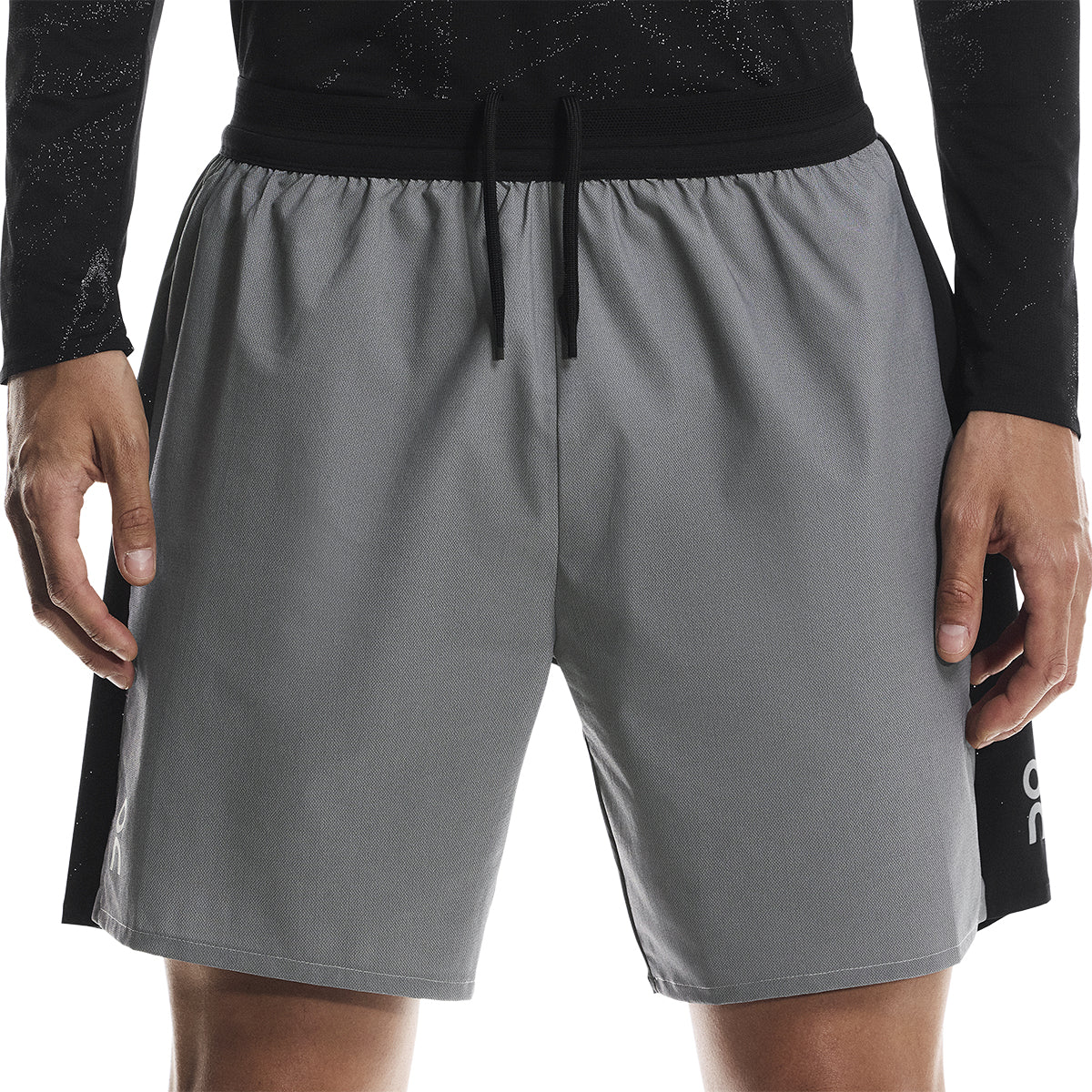 Close-up front view of the On Performance Shorts Lumos in Black showing waistband and drawstring