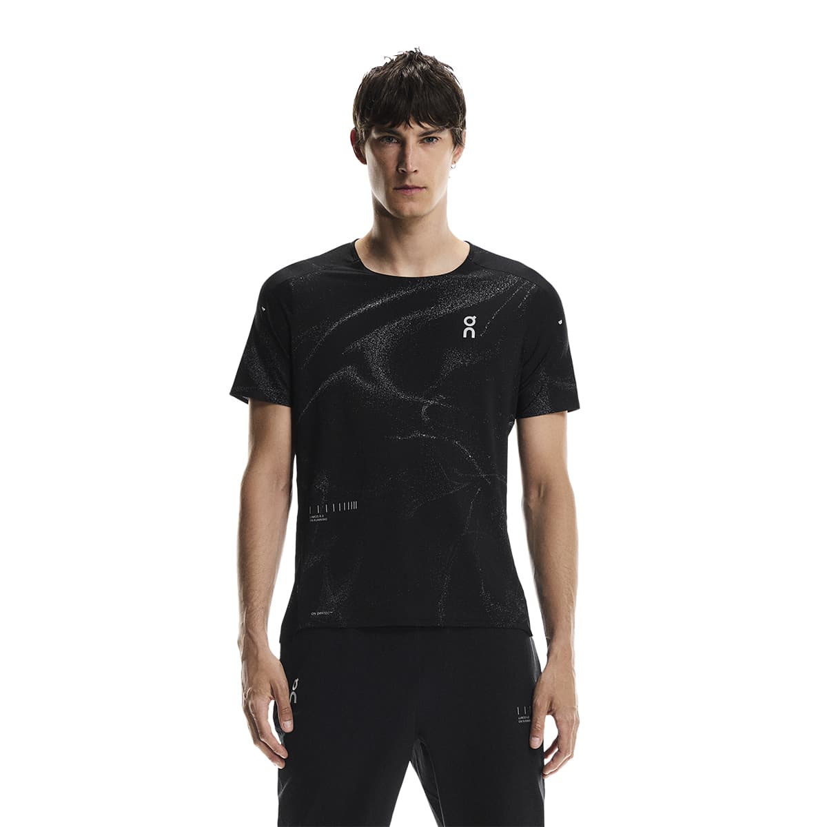 Male model wearing the On Apparel - Performance T Lumos Colour Black, shown from the front