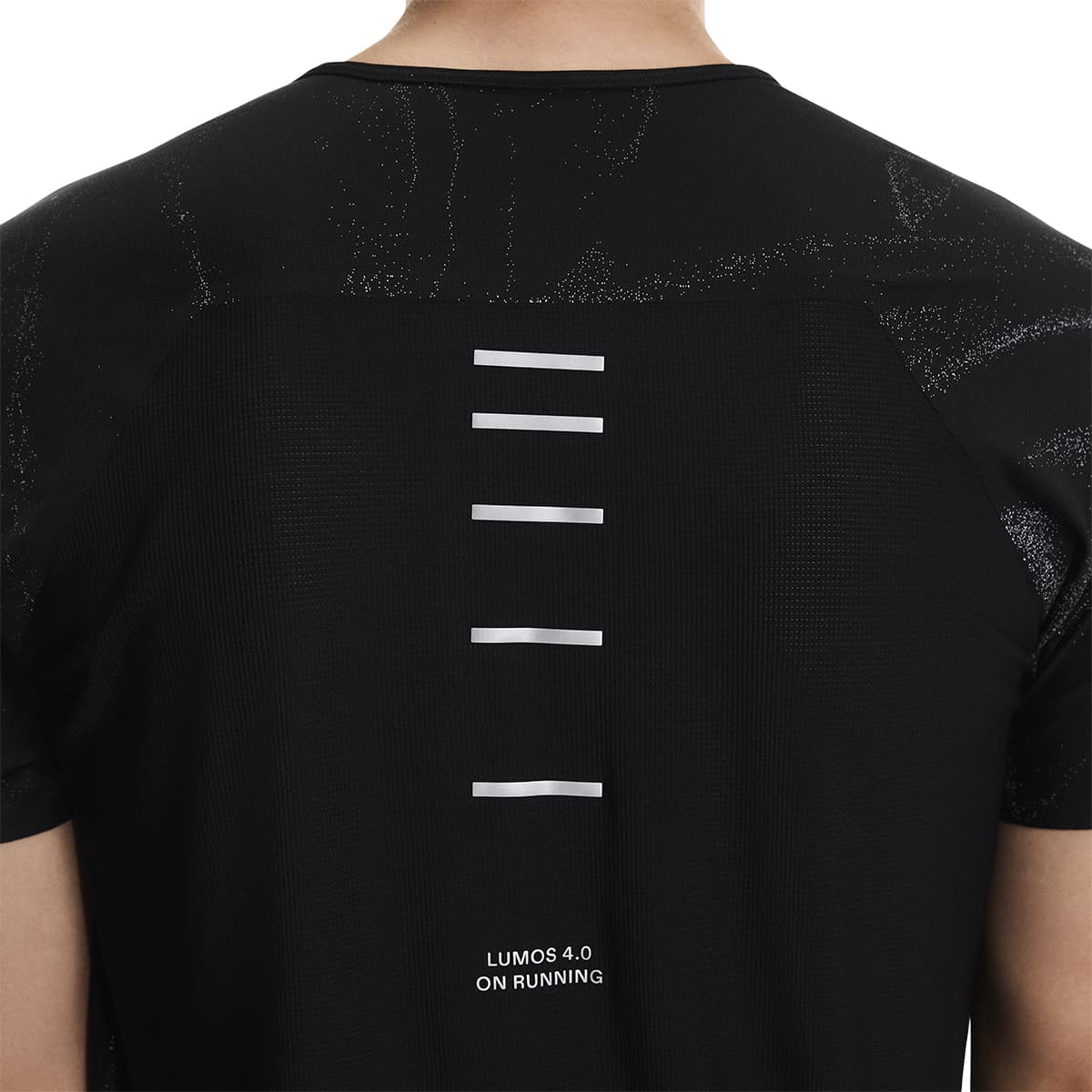 Detail view of the On Apparel - Performance-T Lumos Colour Black close-up reflective back print