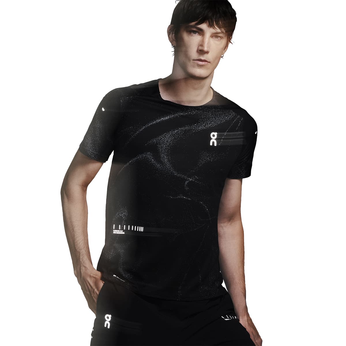 Male model wearing the On Apparel - Performance T Lumos Colour Black, front angled pose