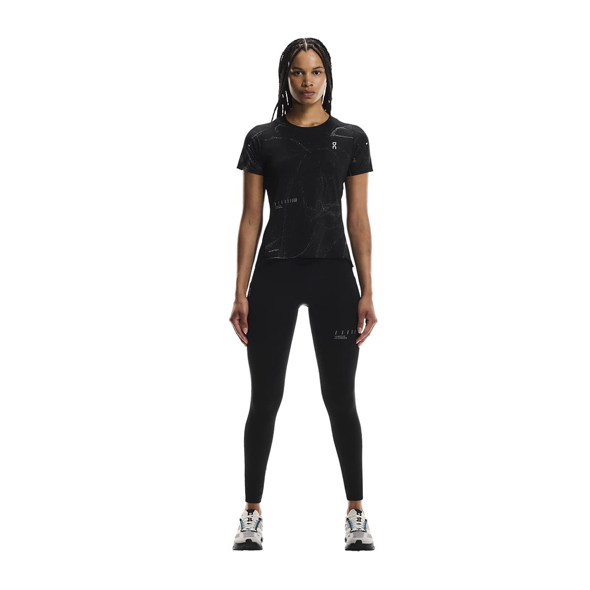 Full-body of female model wearing the On Apparel - Performance T Lumos Colour Black