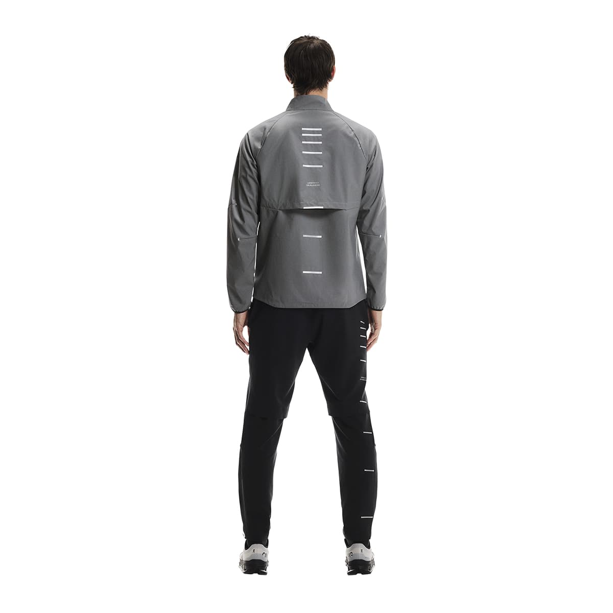 Rear Full body shot of male model wearing the On Weather Jacket Lumos Colour Eclipse