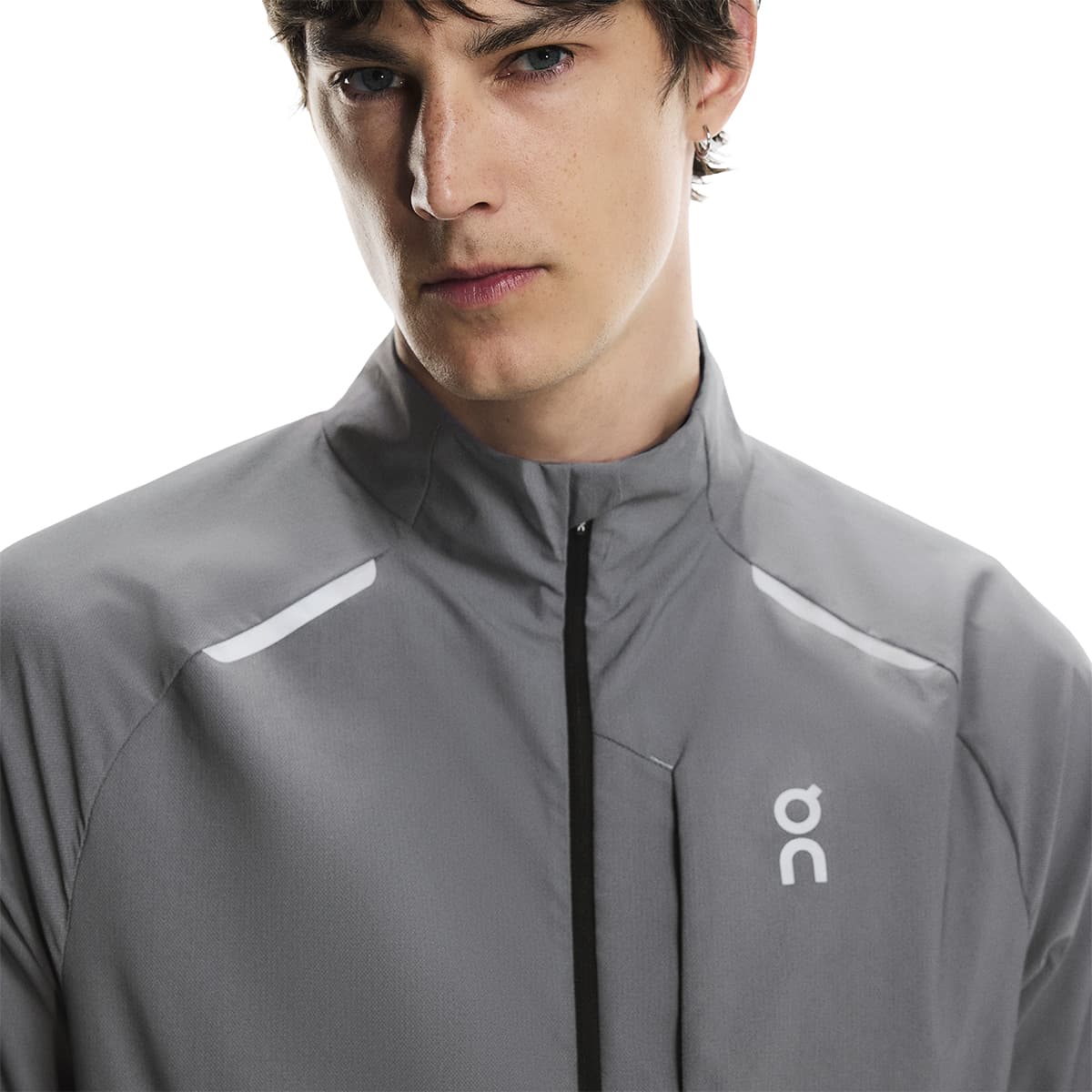Close up view of collar and reflective detail of the On Weather Jacket Lumos Colour Eclipse