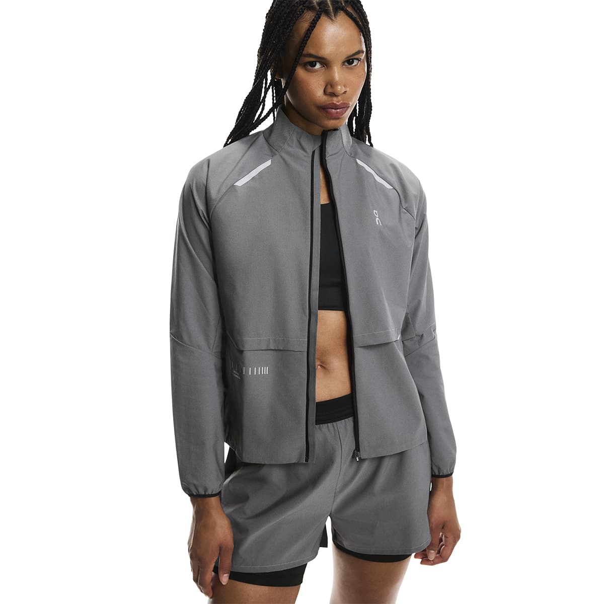 Front view of a female model wearing the On Weather Jacket Lumos Colour Eclipse