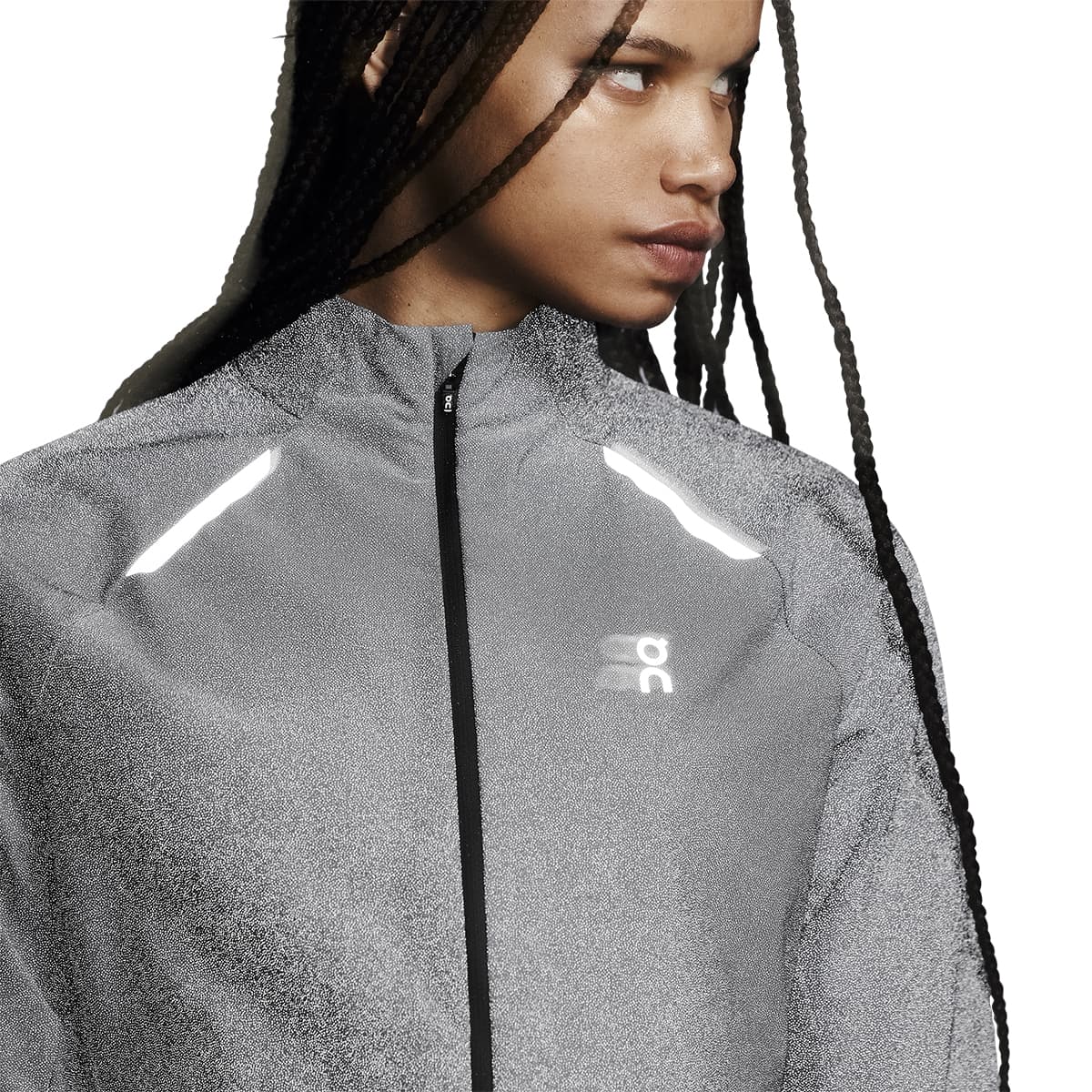 Front view of a female model wearing the Reflective On Weather Jacket Lumos Colour Eclipse