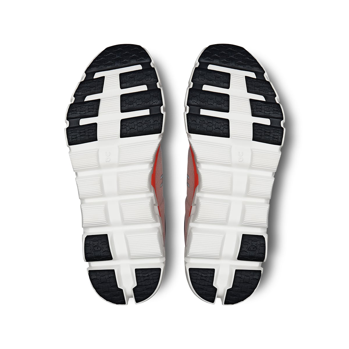 Soles of the On Cloudflow 4 Quartz-Flame women’s running shoes