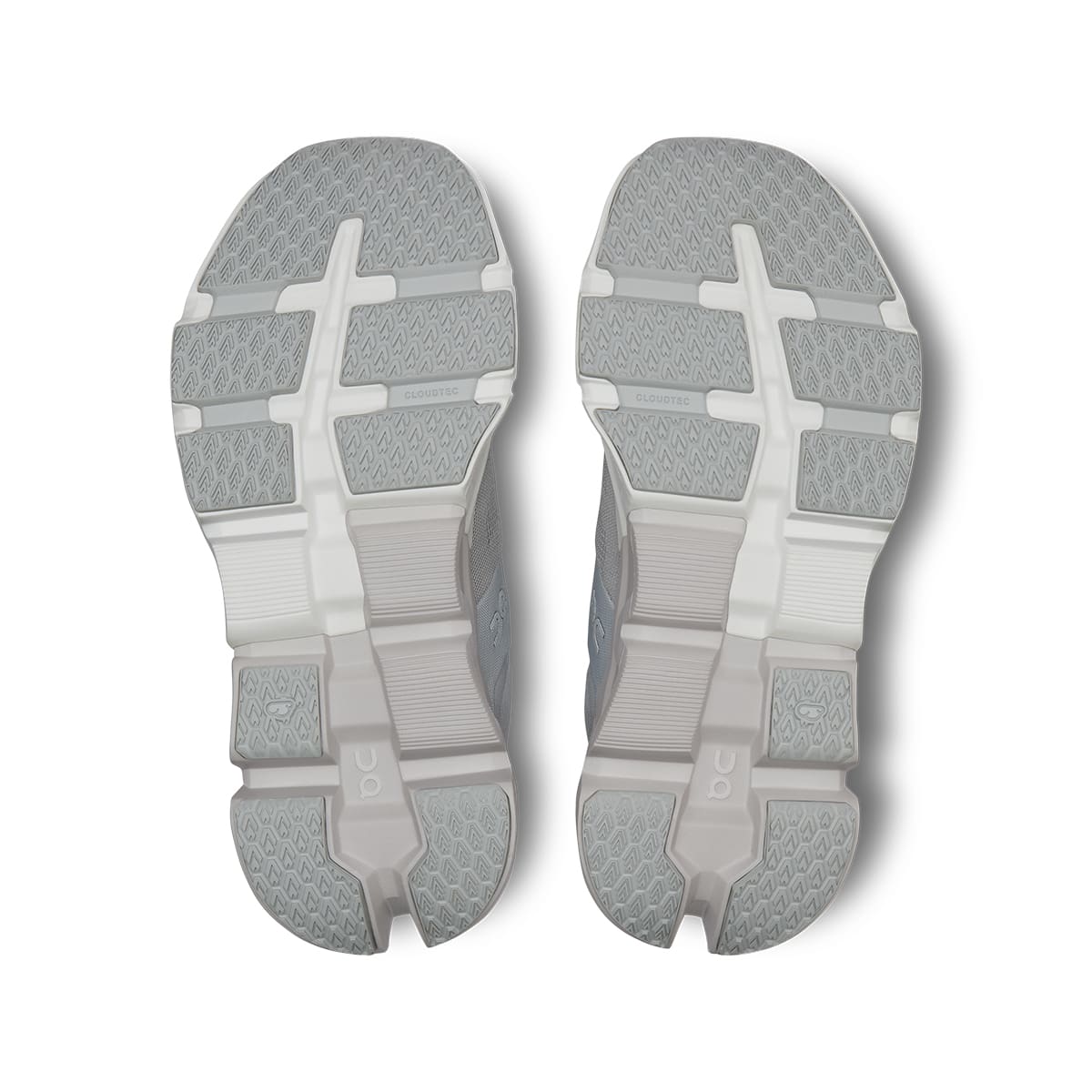 Soles of the On Cloudflyer 5 Glacier-Wolf women’s running shoes