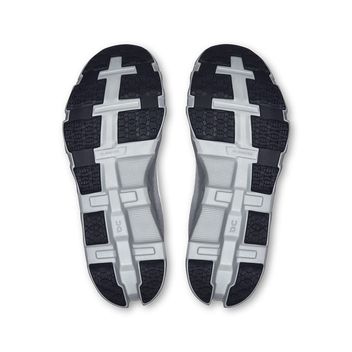 Soles of the On Cloudmonster Hyper Glacier Ivory women’s running shoes