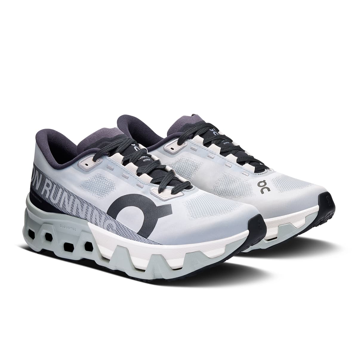 45-degree view of the On Cloudmonster Hyper Glacier Ivory women’s running shoe