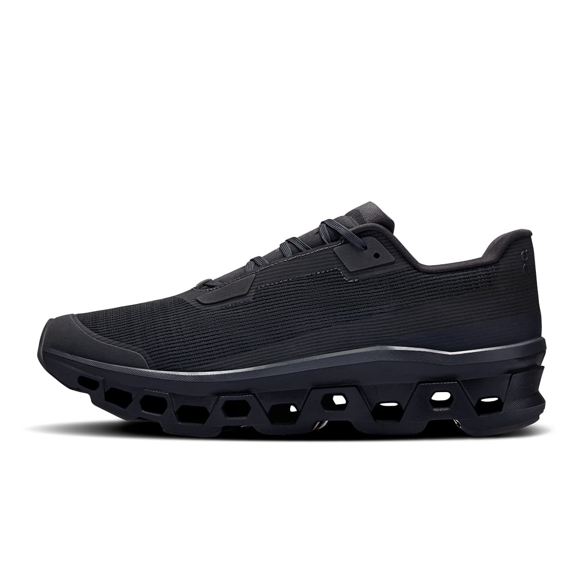 Left side view of the On Cloudmonster Void Black Black men’s running shoe