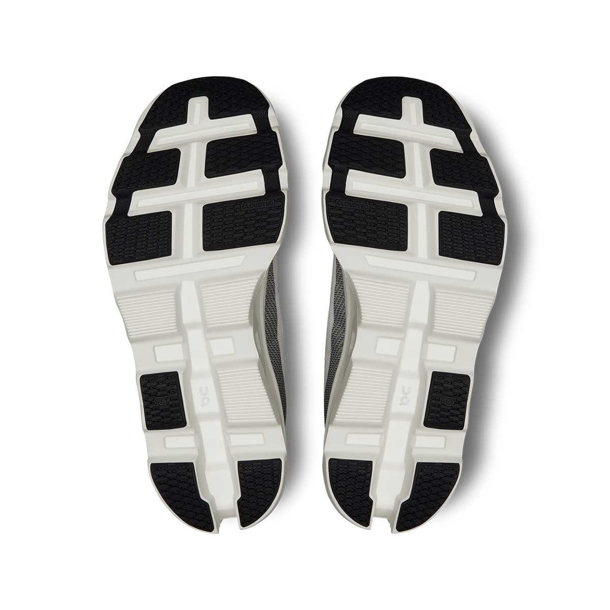 Soles of the On Cloudmonster 2 White-Frost women’s running shoes