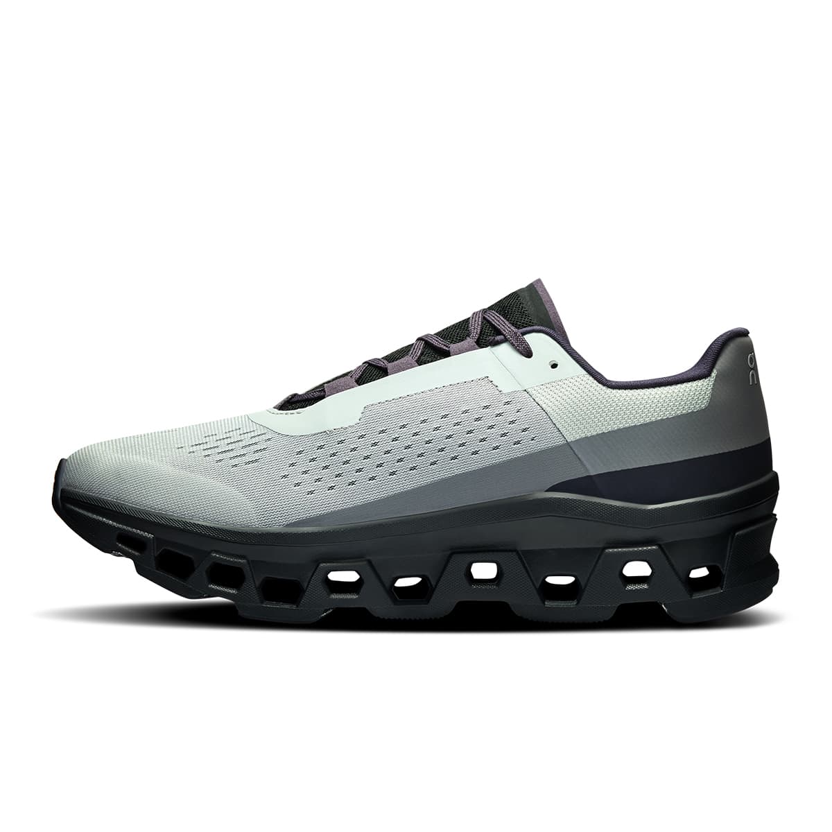 Left side view of the On Cloudmonster Glacier-Black men’s running shoe