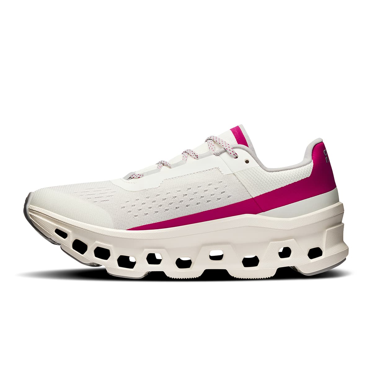 Left side view of the On Cloudmonster Ivory-Grenadine women’s running shoe