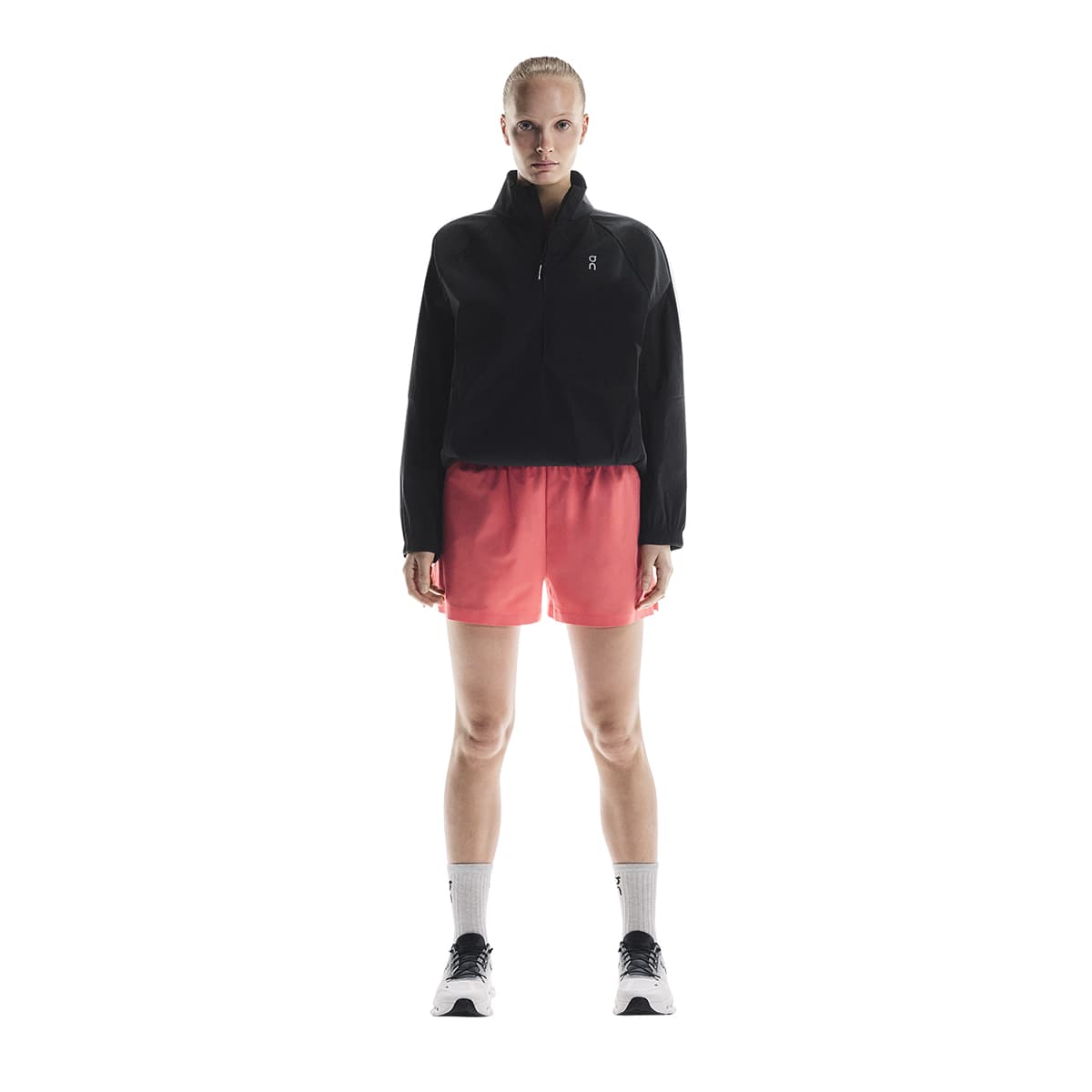 Woman wearing the On Focus Shorts Colour Coral