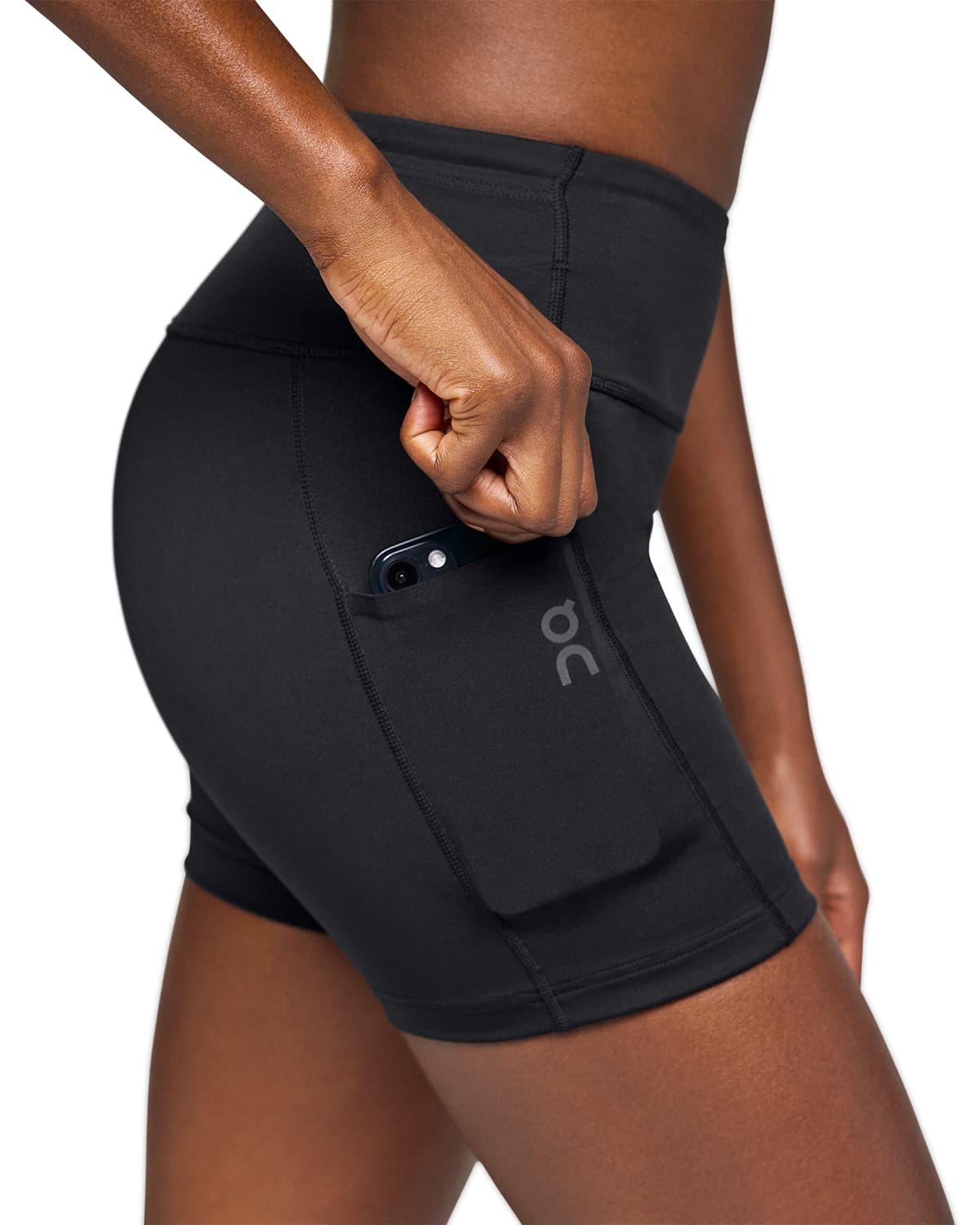 Woman wearing the On Performance Short Tights Colour Black - Front Phone Pocket