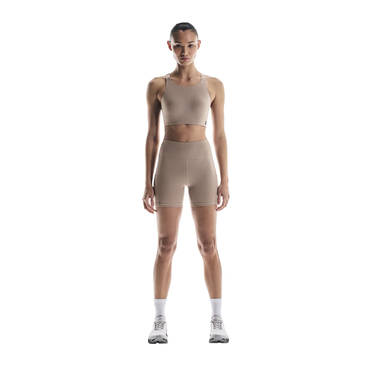 Woman wearing the On Performance Short Tights Colour Cinder