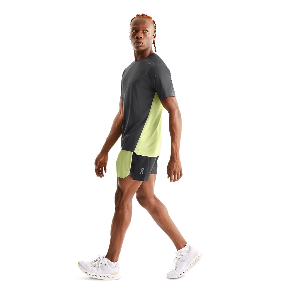 Man wearing the On Performance T Colour Shadow-Hay - Side Angle