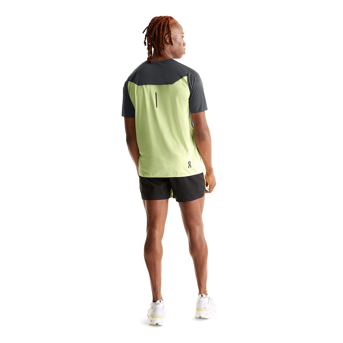 Man wearing the On Performance T Colour Shadow-Hay - Back Angle