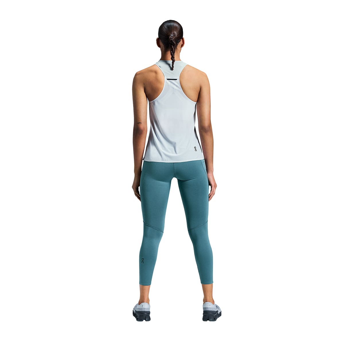 Woman wearing the On Performance Tights 7-8 Colour Storm - Back View