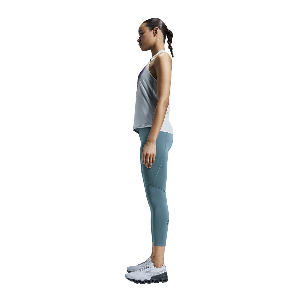 Woman wearing the On Performance Tights 7-8 Colour Storm - Side Profile