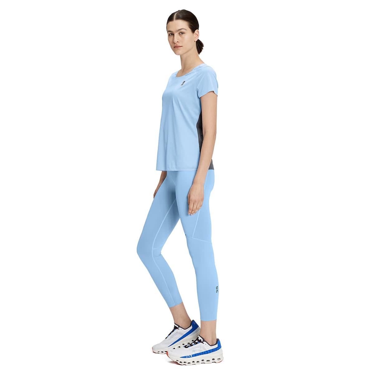 Woman wearing the On Performance Tights 7-8 Colour Stratosphere - Side Profile
