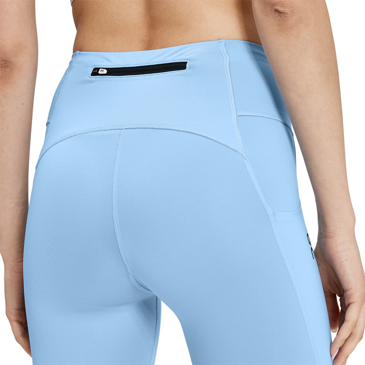 Woman wearing the On Performance Tights 7-8 Colour Stratosphere - Secure Back Pocket
