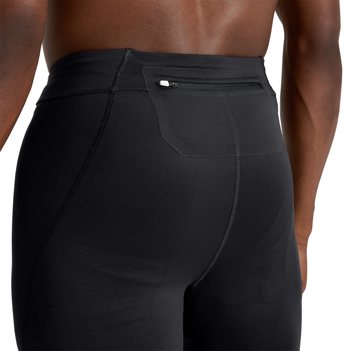 Man wearing the On Performance Tights Colour black - View Back Zipped Pocket