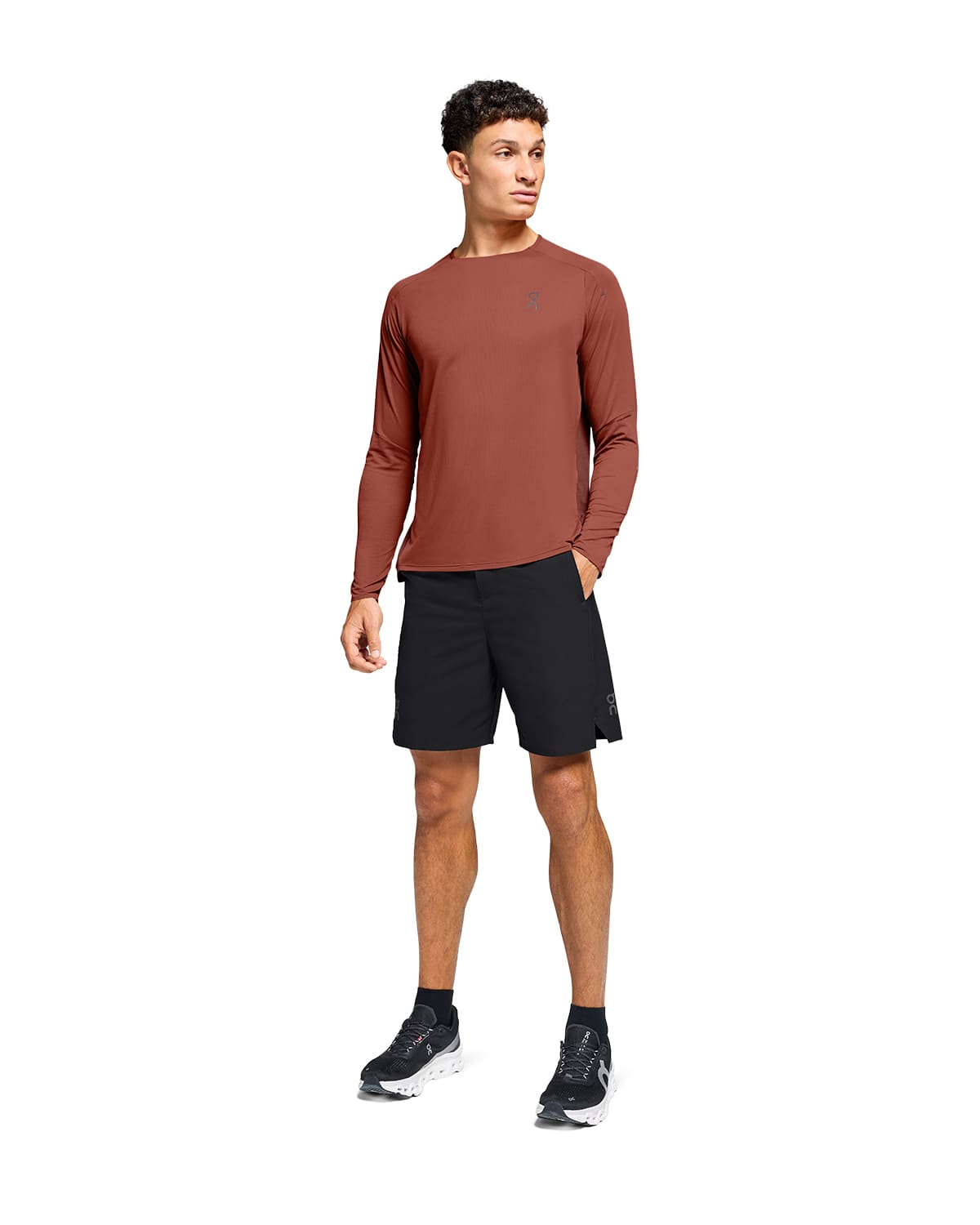Man wearing the On Preformance Hybrid Shorts Colour Black - Front View