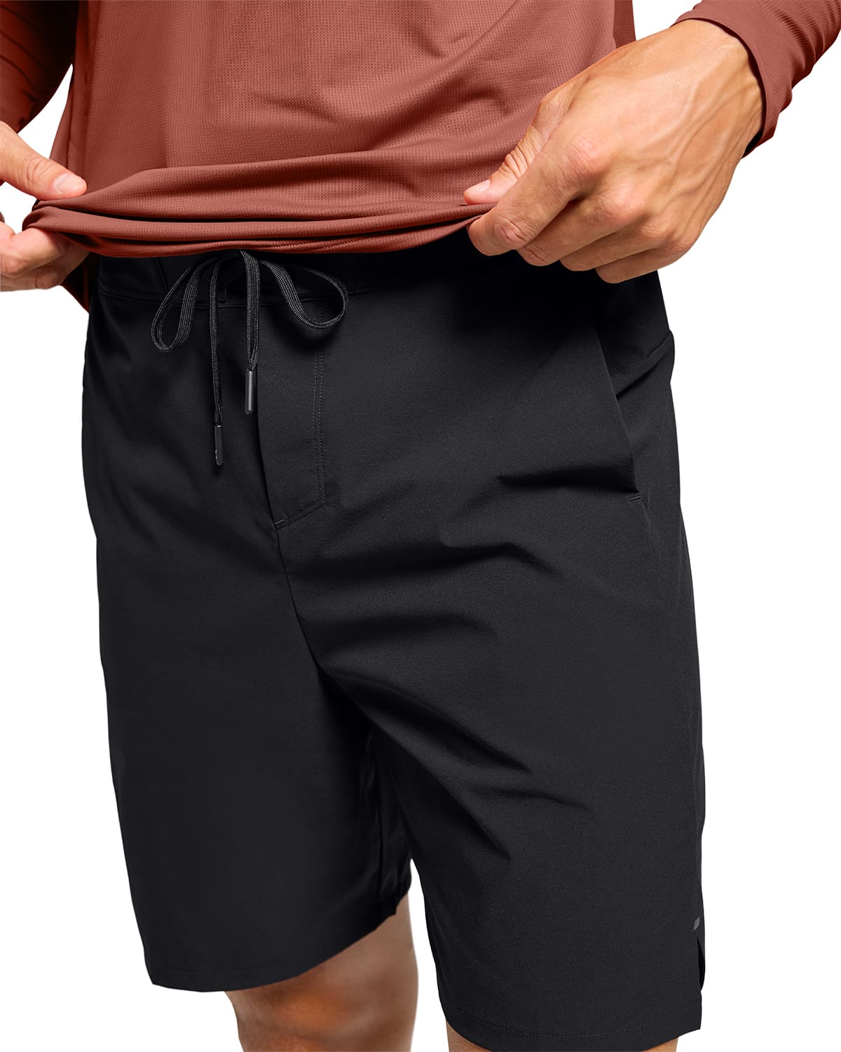Man wearing the On Preformance Hybrid Shorts Colour Black - Detail Draw Strings