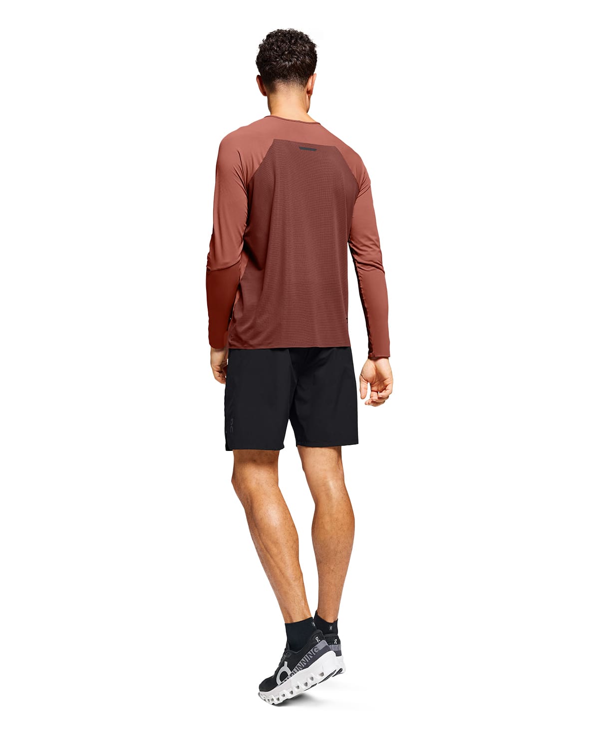 Man wearing the On Preformance Hybrid Shorts Colour Black - Back View