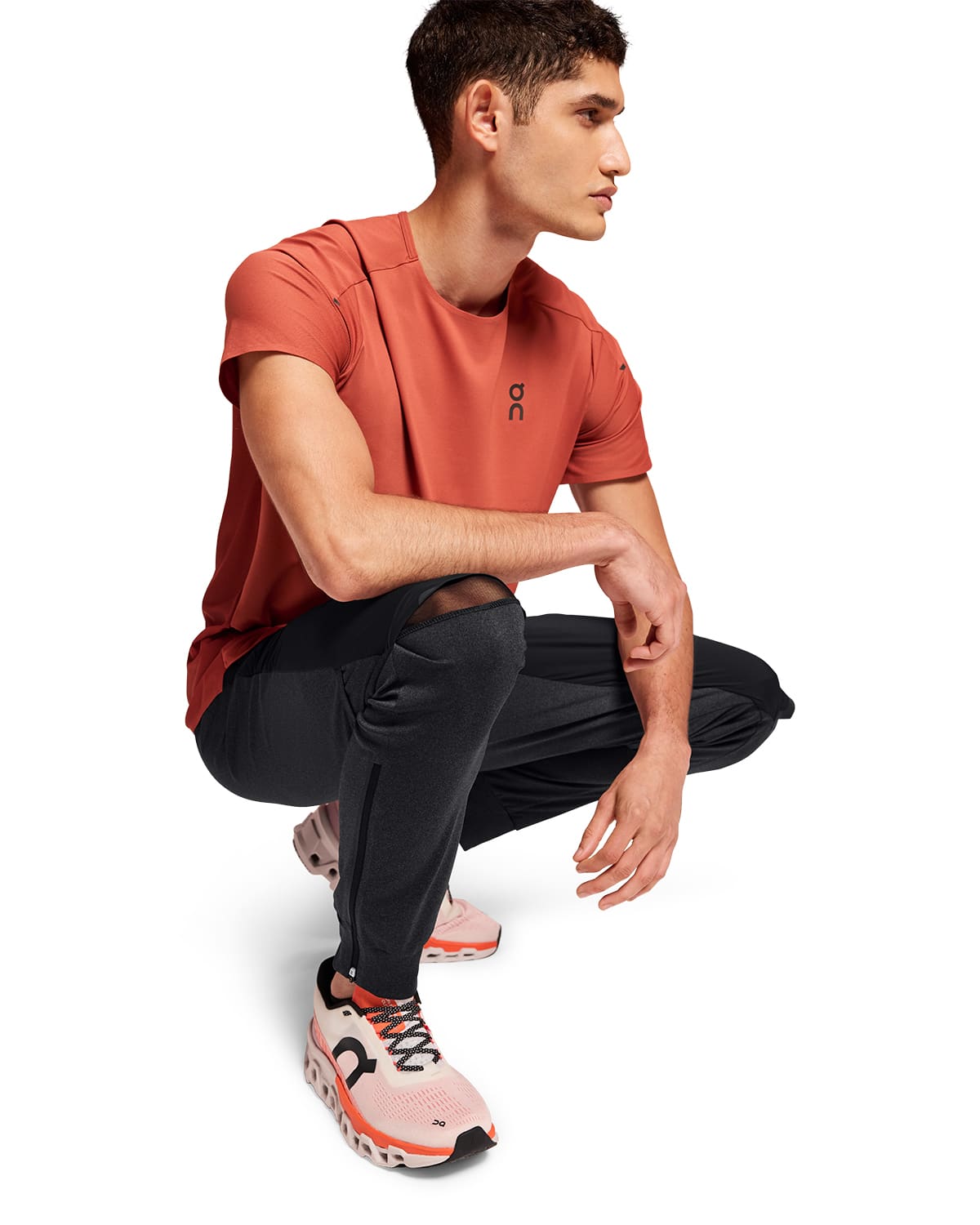 Man wearing the On Weather Pants Colour Black - Showing Knee Cutout