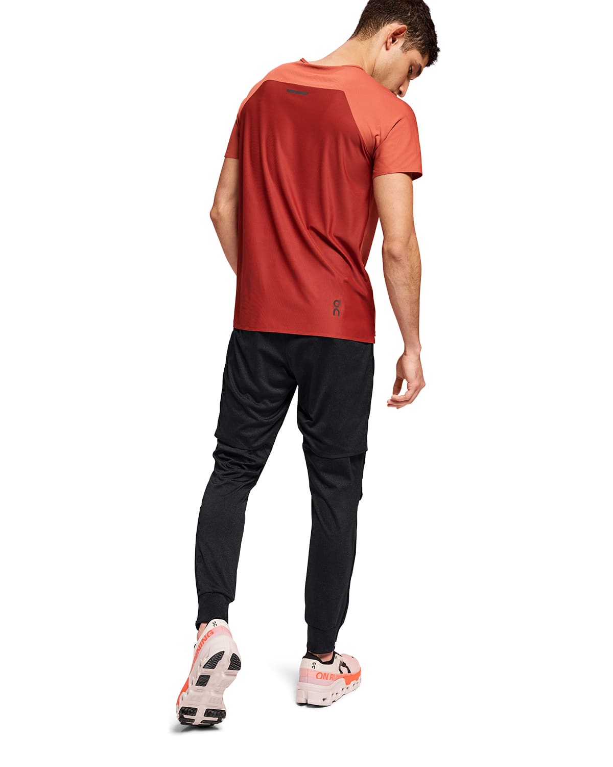 Man wearing the On Weather Pants Colour Black - Back View #color_black